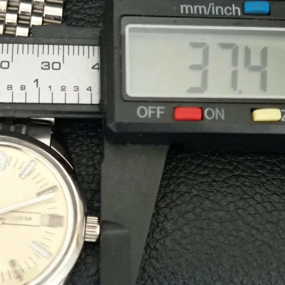 Vintage 1981 Citizen Manual Mens Silver Watch & Beige accents